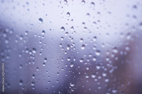 Raindrops on the glass window blur