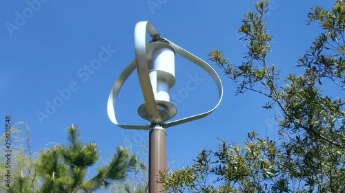 Small scale wind turbine turning in the wind.