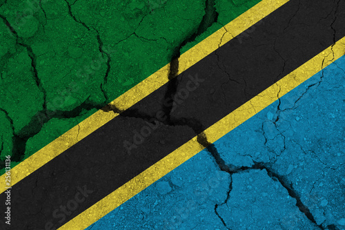 Tanzania flag on the cracked earth