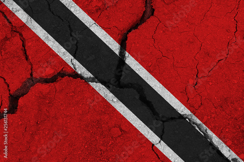 Trinidad and Tobago flag on the cracked earth