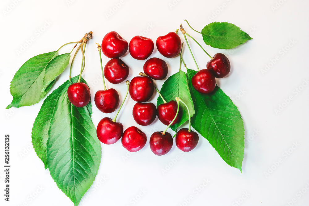berries and leaves of cherry on a white background.
