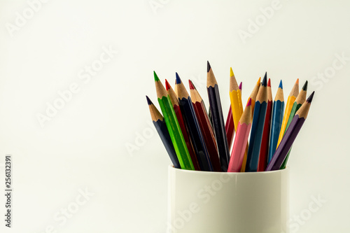 colorful of color pencils in white coffee cup. © sema_srinouljan