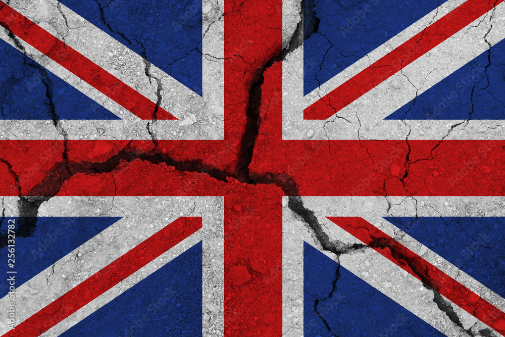 Fototapeta premium United Kingdom flag on the cracked earth