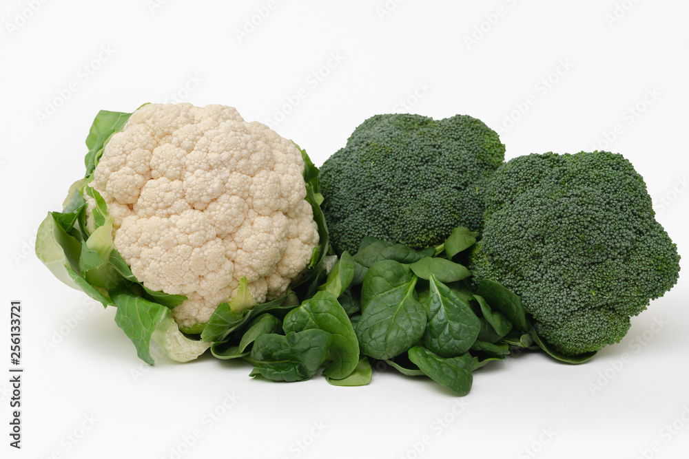 Fresh vegetable isolated on white. Cauliflower, broccoli, haricots, tomatoes, and spinach close up Fresh vegetable isolated on white. Cauliflower, broccoli, haricots, tomatoes, and spinach close up