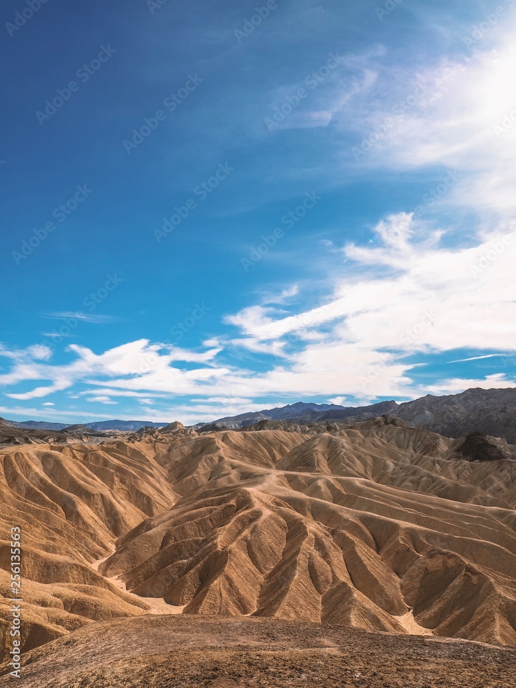 Naklejka premium Picturesque Soft Waves From Multi-Coloured Sandstone. Death Valley, Zabriski