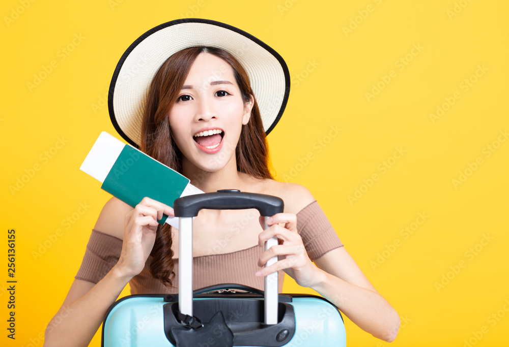 happy tourist woman in summer hat holding passport and suitcase happy tourist woman in summer hat holding passport and suitcase