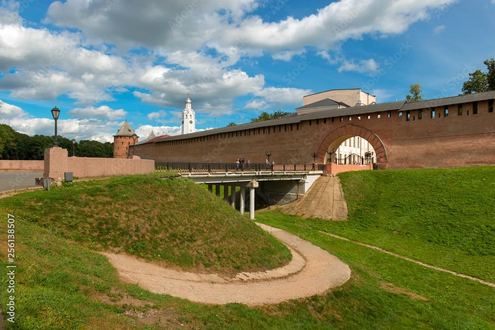 VELIKY NOVGOROD, RUSSIA - AUGUST 14, 2018:  Resurrection arch and the bridge entrance to the Kremlin. Walls and towers of the Novgorod Kremlin, Russia.