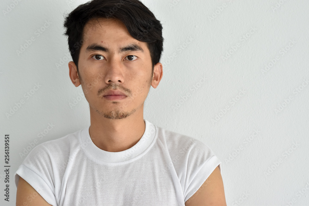 Young Asian man close up shot isolated on white