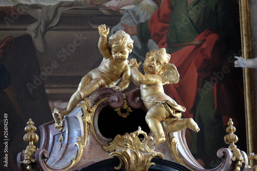 Angels, statue on the main altar in Amorbach Benedictine monastery church in Lower Franconia, Bavaria, Germany photo