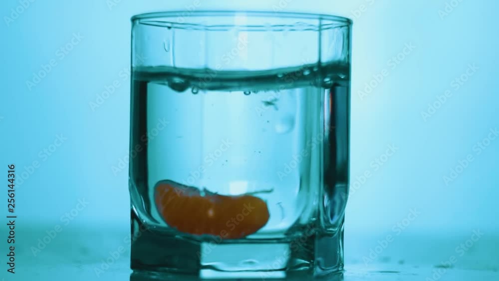 Fruit falling into glass. Slow motion Fruit falling into glass. Slow motion