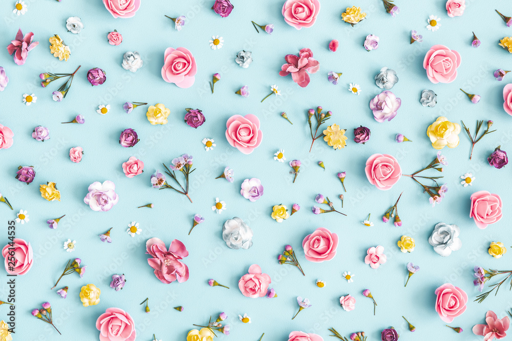 Flowers composition. Pattern made of colorful flowers on pastel blue background. Spring, easter, summer concept. Flat lay, top view - obrazy, fototapety, plakaty 