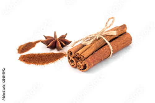 Cinnamon stick and star anise spice isolated on white background closeup