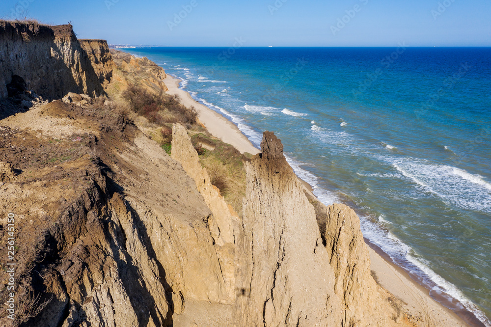 Mountain landslide in an environmentally hazardous area. Large crack in ground, descent of large layers of dirt. Deadly danger at foot of landslide mountain. Soil erosion Avalanche. Steep coast, crack