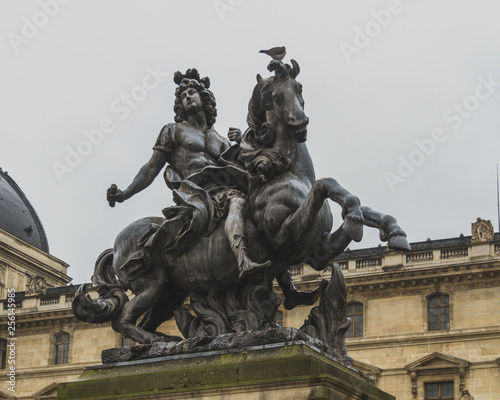Equestrian Statue of King Louis XIV in the courtyard of Louvre, in Paris, France