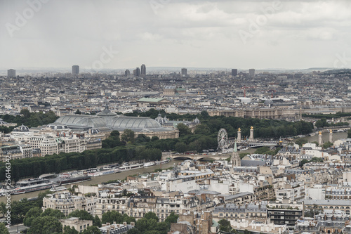View of the city of Paris, France from top of Eiffel Tower on a cloudy day