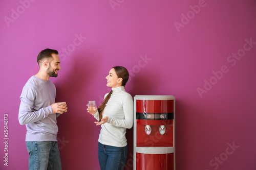 Man and woman drinking wate...