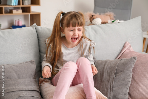 Portrait of crying little g...