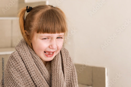 Portrait of crying little g...