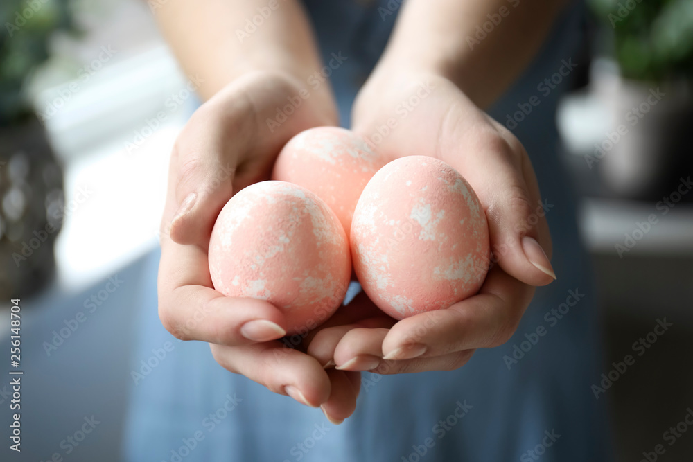 Woman holding painted Easter eggs, closeup Woman holding painted Easter eggs, closeup