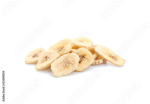 Tasty dried slices of banana on white background