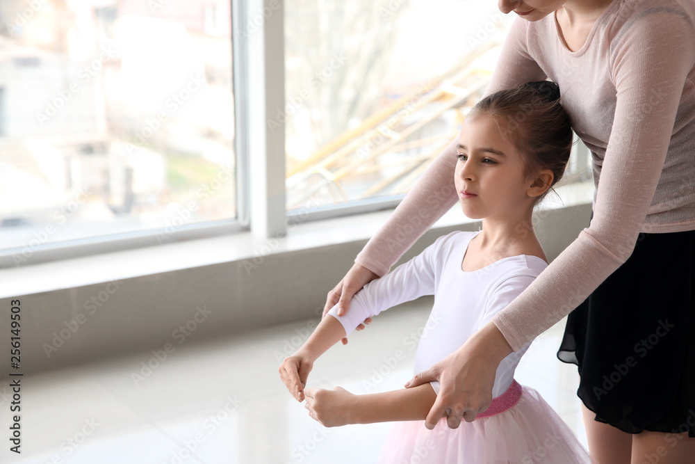 Little ballerina training with coach in dance studio Little ballerina training with coach in dance studio
