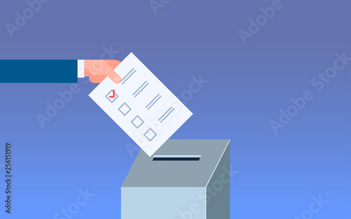 Election day concept voter hand putting paper