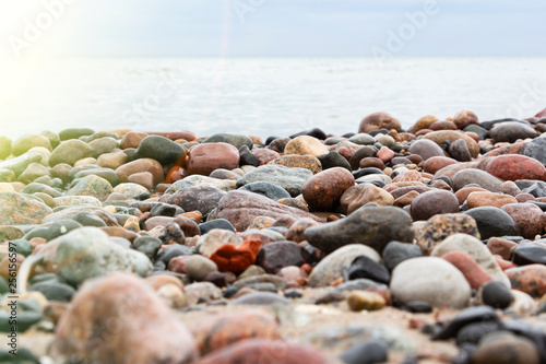 Close - up of rocky beach in the evening.