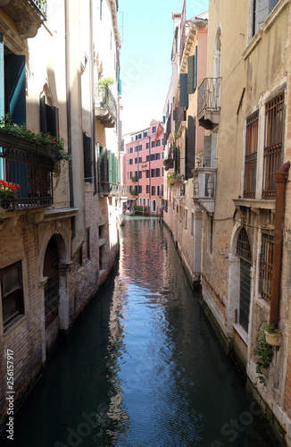 View of the beautiful and colorful small canals and historic buildings in Venice  Italy 
