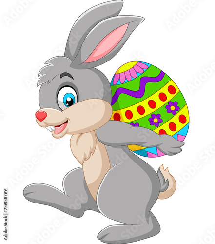 Cartoon rabbit carrying an Easter egg