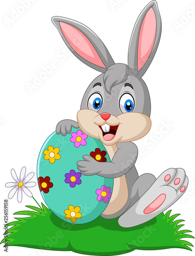 Cartoon bunny holding Easter egg