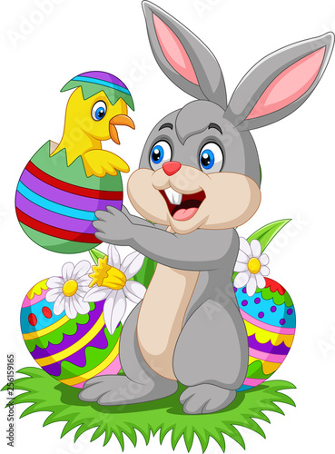 Cartoon rabbit holding a baby chick hatching from an Easter egg