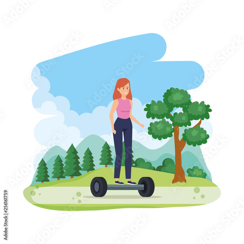 young woman in hoverboard electric in the field