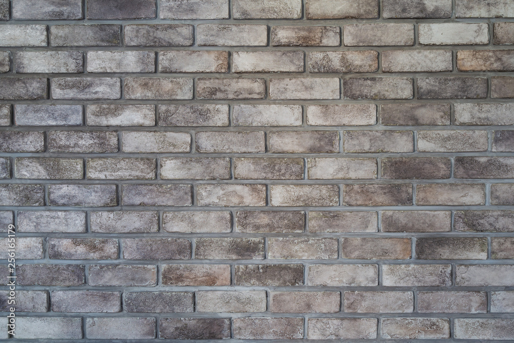Patterned gray brick wall for background picture.