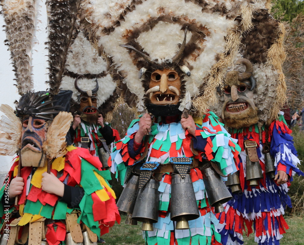 Zemen, Bulgaria - March 16, 2019: Masquerade festival Surva in Zemen, Bulgaria. People with mask called Kukeri dance and perform to scare the evil spirits.