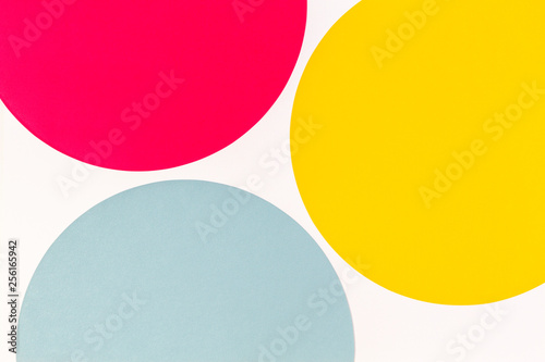 Abstract color paper background. Pastel blue, yelllow and red color round circle shape geometry composition on white background. Top view