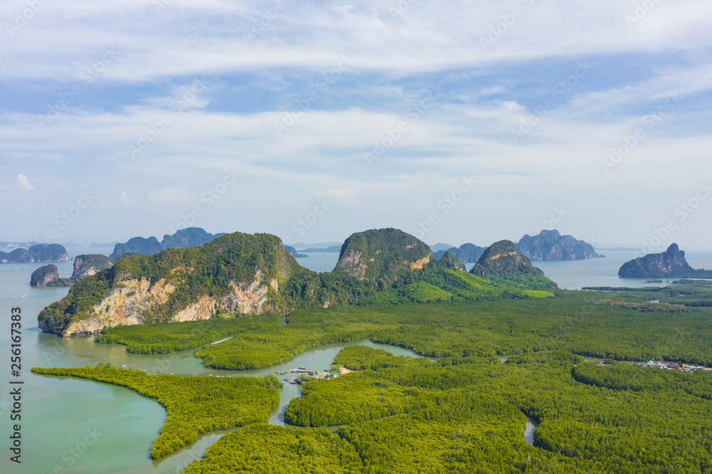 View from above, aerial view of the beautiful Phang Nga Bay (Ao Phang Nga National Park) with the sheer limestone karsts that jut vertically out of the emerald-green water, Thailand.