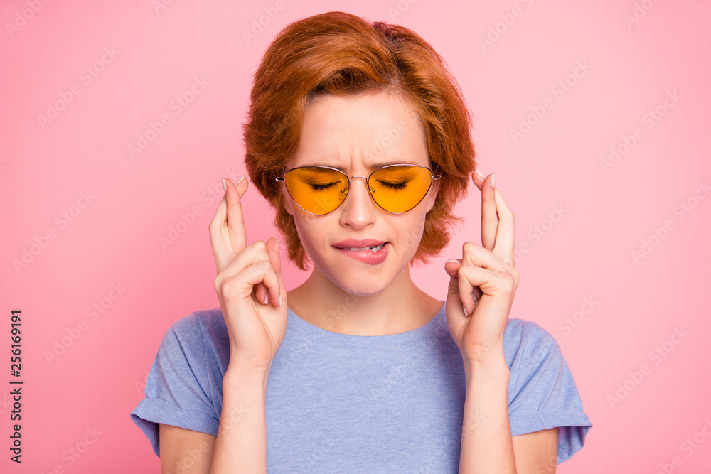 Close-up portrait of her she nice cute charming attractive lovely worried scared girl wearing casual t-shirt yellow glasses biting lip thinking about future isolated over pink background