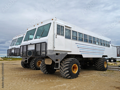 tundra buggy waiting for tourists to watch polar bears in churchill, manitoba