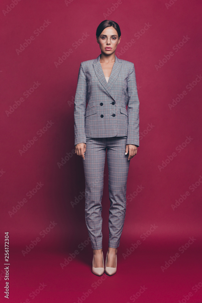 Vertical full length body size view portrait of her she nice cute sweet pretty attractive lovely charming candid lady on high heels shoes isolated over maroon burgundy marsala pastel background Vertical full length body size view portrait of her she nice cute sweet pretty attractive lovely charming candid lady on high heels shoes isolated over maroon burgundy marsala pastel background