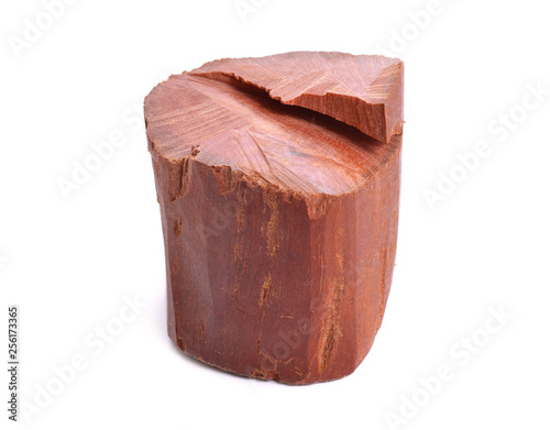 Chandan or red sandalwood piece isolated on white baclground photo