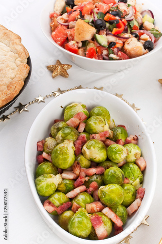 Bowl of Roasted Brussels  Sprouts with Bacon on a Christmas Dinner Table