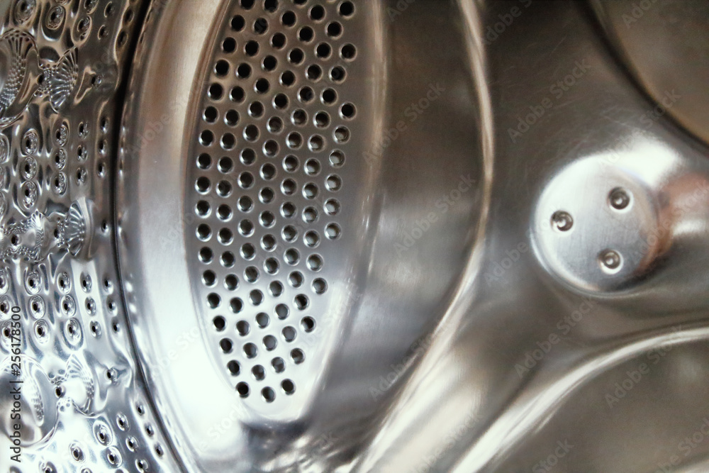 Washing machine drum inside. Close-up. Background. Texture. Washing machine drum inside. Close-up. Background. Texture.