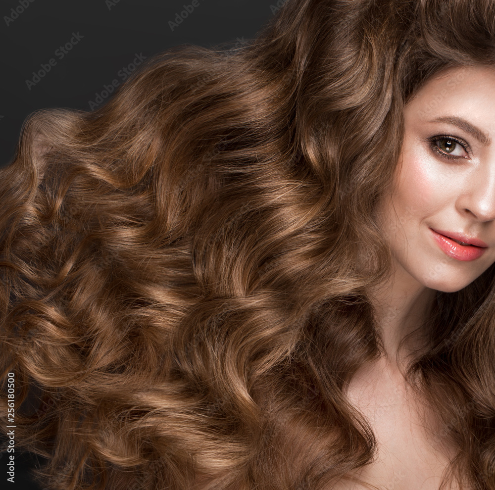 Beautiful brown-haired girl with a perfectly curls hair, and classic make-up. Beauty face. Beautiful brown-haired girl with a perfectly curls hair, and classic make-up. Beauty face.