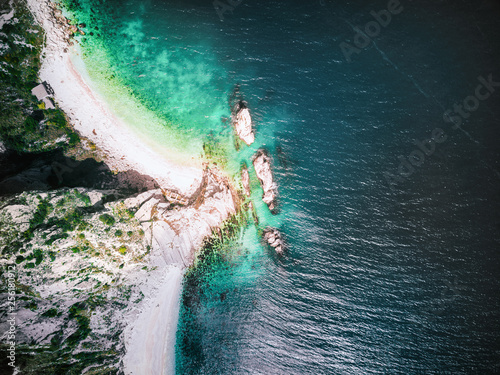 aerial view of a beautiful beach and sea with crystal clear water in the conero coast, italy