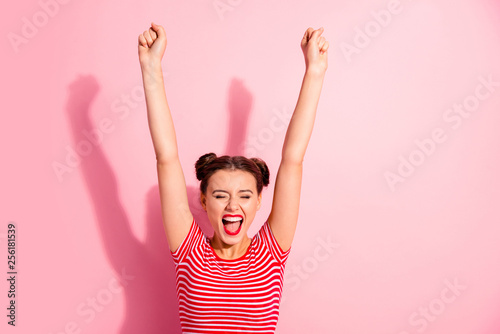 Portrait of her she nice-looking cute charming attractive adorable fascinating lovely cheerful cheery girl wearing striped t-shirt raising hands up isolated over pink pastel background