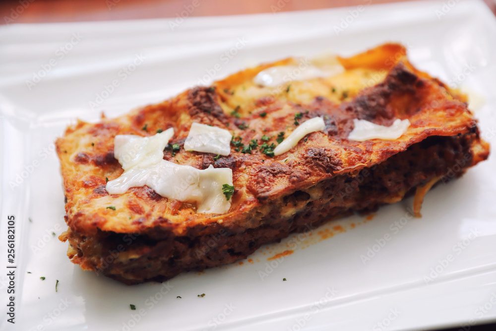 Beef lasagna on wooden background , Italian food Beef lasagna on wooden background , Italian food
