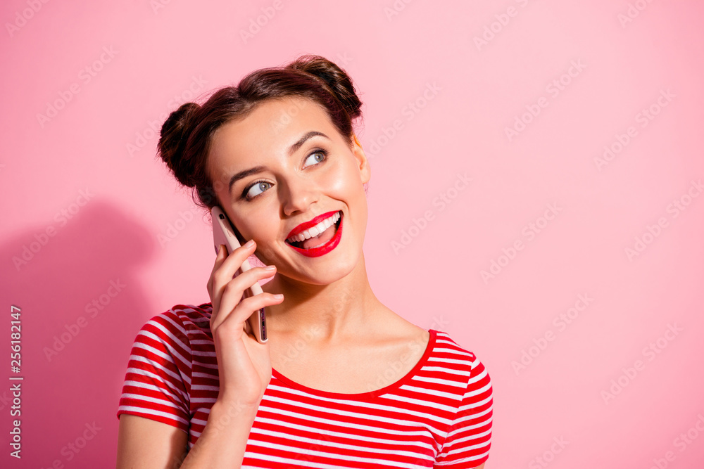 Close-up portrait of her she nice-looking cute attractive fascinating glamorous cheerful cheery girl wearing striped t-shirt talking on phone isolated over pink pastel background Close-up portrait of her she nice-looking cute attractive fascinating glamorous cheerful cheery girl wearing striped t-shirt talking on phone isolated over pink pastel background
