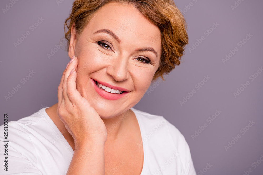 Close up photo beautiful amazing mature she her lady look sincere friendly check touch facial skin use user expensive wash lotion smearing cream wear white t-shirt isolated grey background Close up photo beautiful amazing mature she her lady look sincere friendly check touch facial skin use user expensive wash lotion smearing cream wear white t-shirt isolated grey background