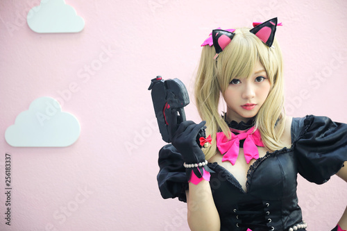 Japan anime cosplay , portrait of girl cosplay in pink room background