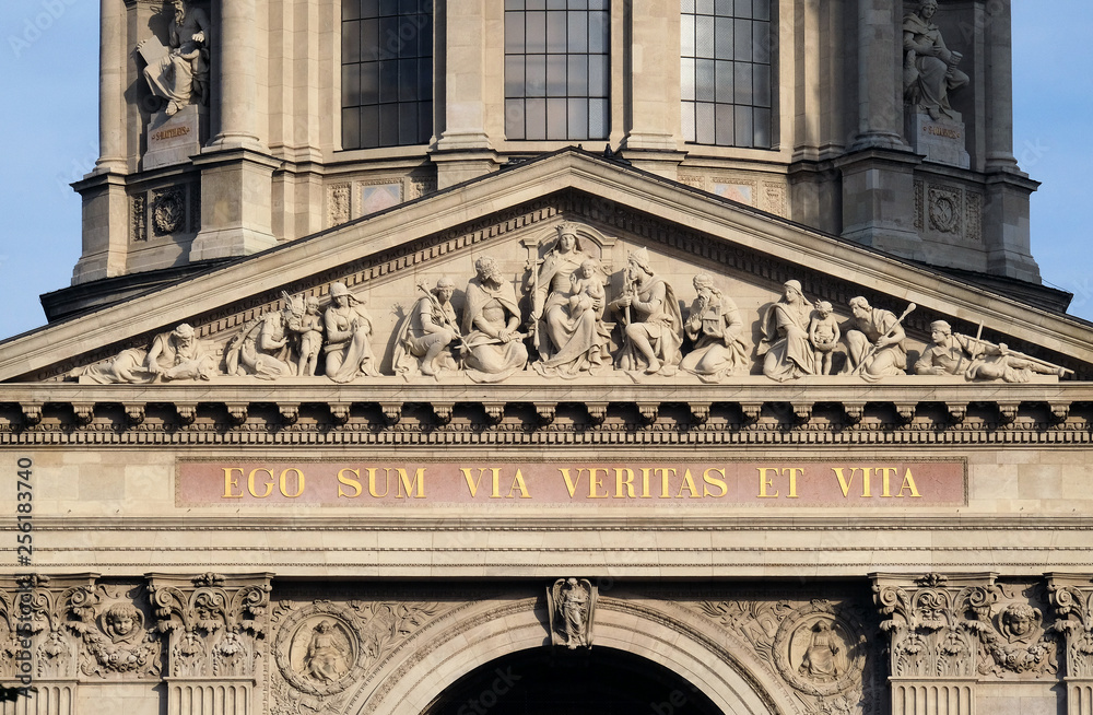 Tympanum bass relief showing the Virgin Mary and Hungarian saints, St. Stephen`s Basilica in Budapest, Hungary